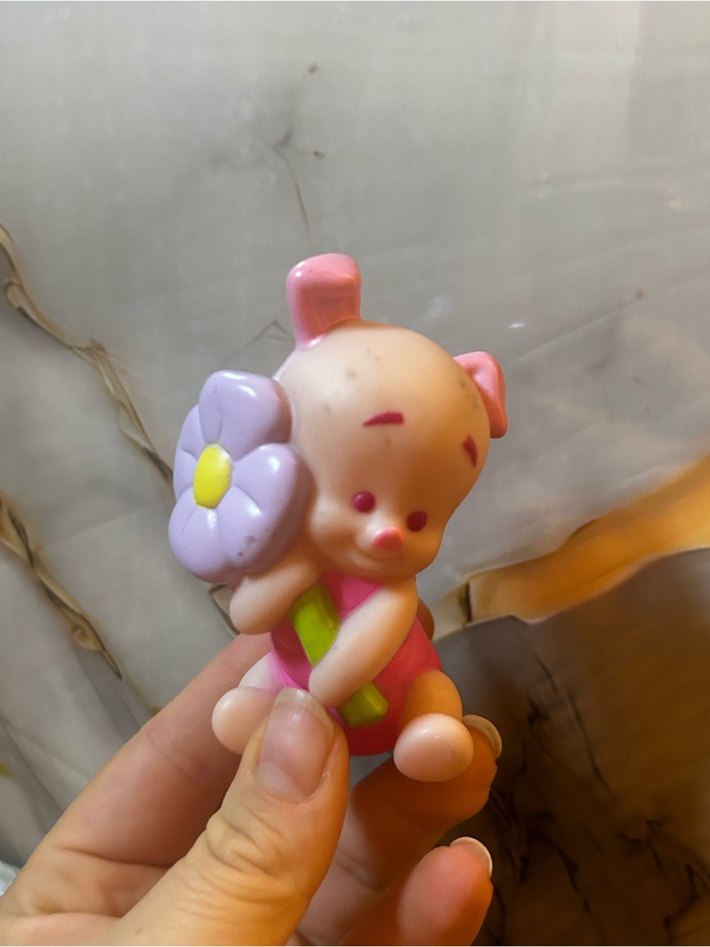 Little-people baby piglet with purple flower